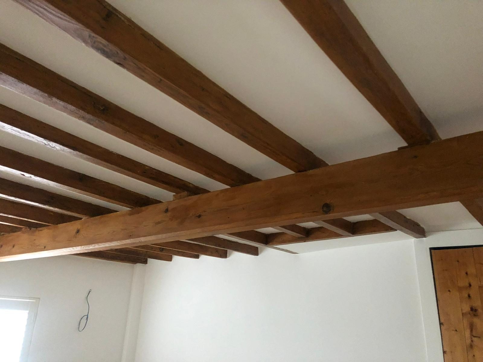 Plastered ceiling and beams in a whole-house refurbishment