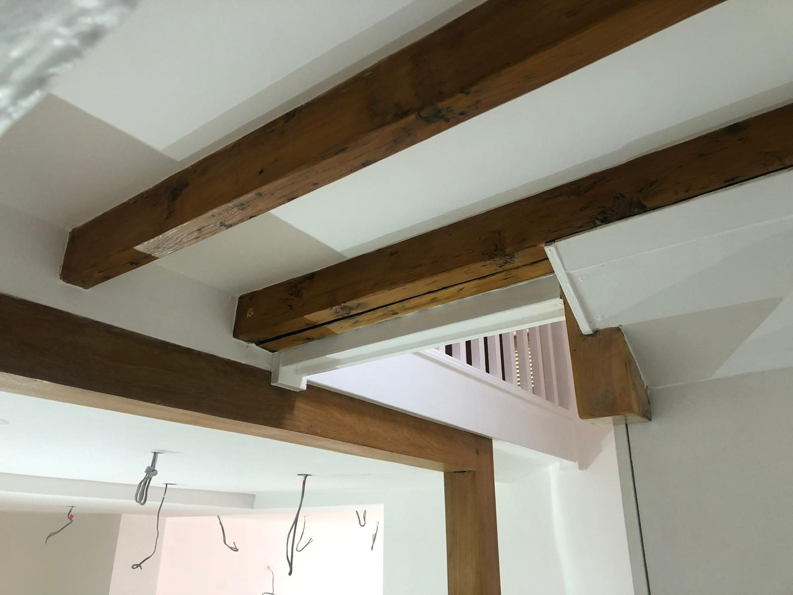 Period beams cleaned and re-set against fresh plasterwork